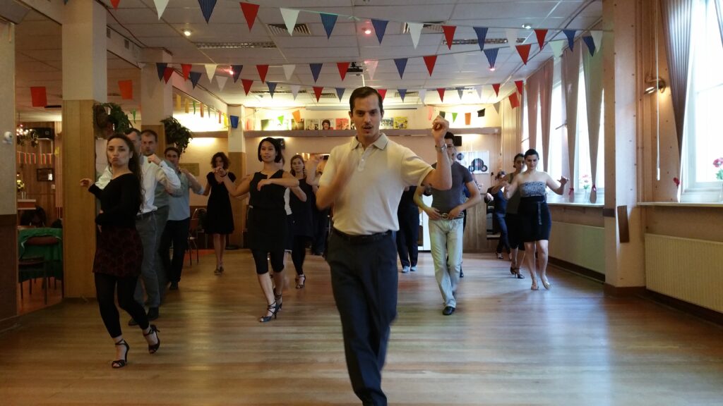 Team members moving together during a beginner-friendly corporate tango workshop